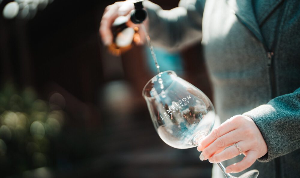 Pouring wine into a glass for tasting